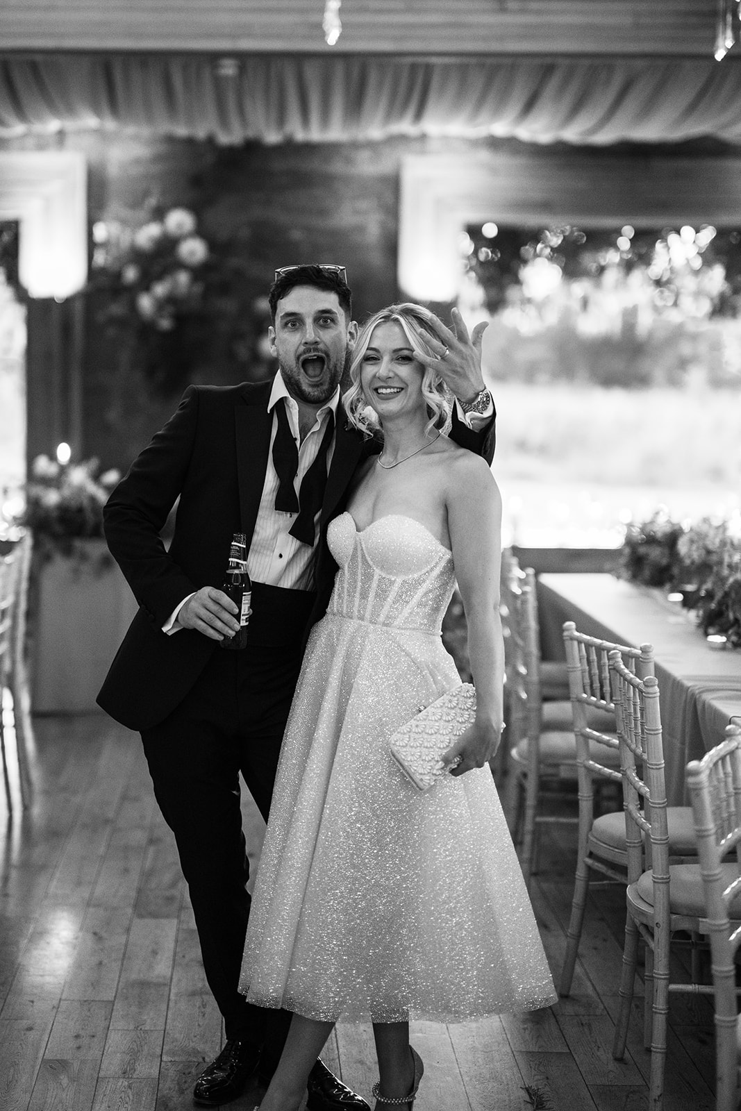 Cinematic editorial wedding photograph by Gary Nunn — vintage Jaguar, golden hour, heart-shaped sunglasses